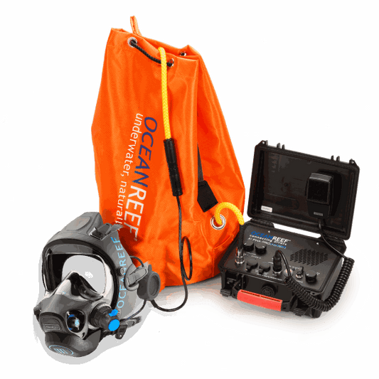 Ocean Reef Alpha Pro X-Divers communication system with headset, surface unit, and orange storage bag.