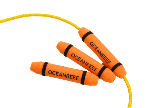 Ocean Reef Cable Floater with orange foam floats and Velcro straps on a yellow cable.